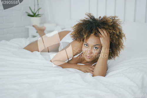 Image of Sensual model posing on bed