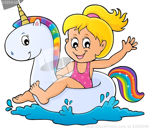 Image of Girl floating on inflatable unicorn 1