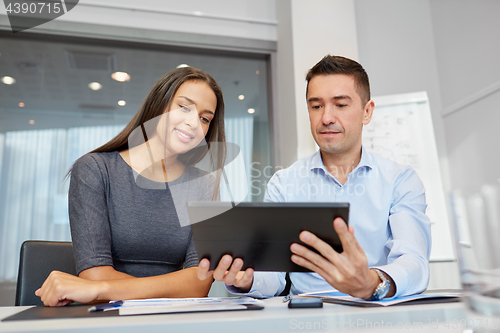 Image of business team with tablet pc at office