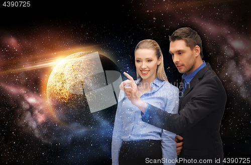 Image of businessman and businesswoman over space