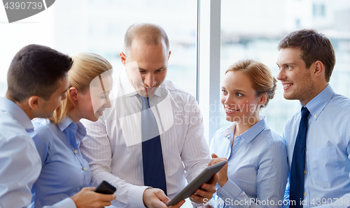 Image of business team with tablet pc computer at office