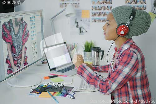 Image of Trendy designer working with computer