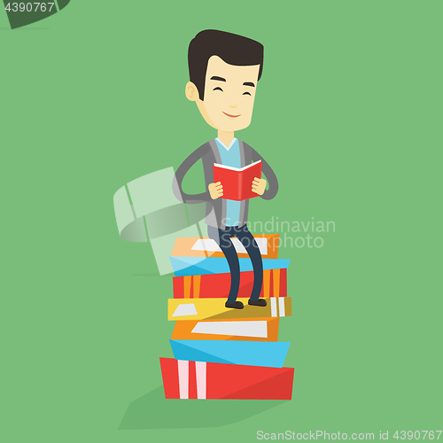 Image of Student sitting on huge pile of books.