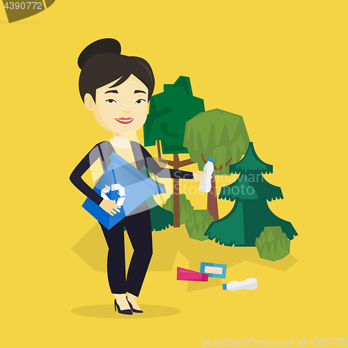 Image of Woman collecting garbage in forest.