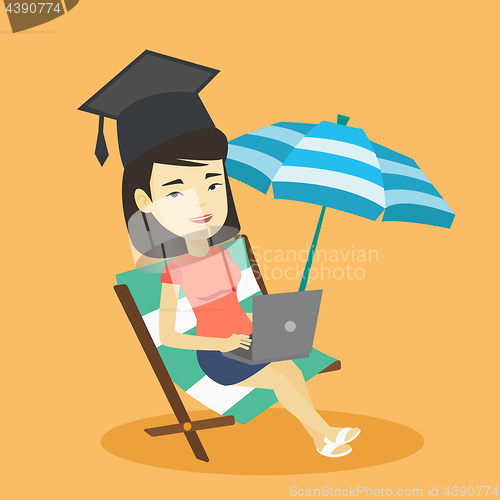 Image of Graduate lying in chaise lounge with laptop.
