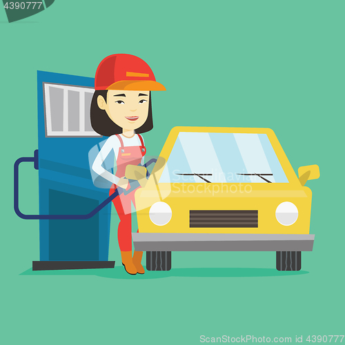 Image of Worker filling up fuel into car at the gas station