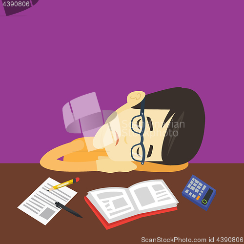 Image of Student sleeping at the desk with book.