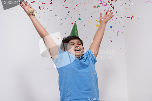 Image of kid blowing confetti