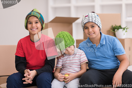 Image of boys with cardboard boxes around them