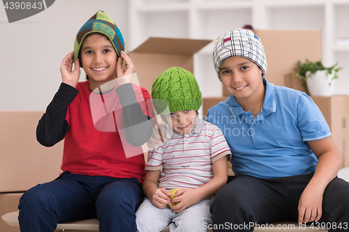 Image of boys with cardboard boxes around them