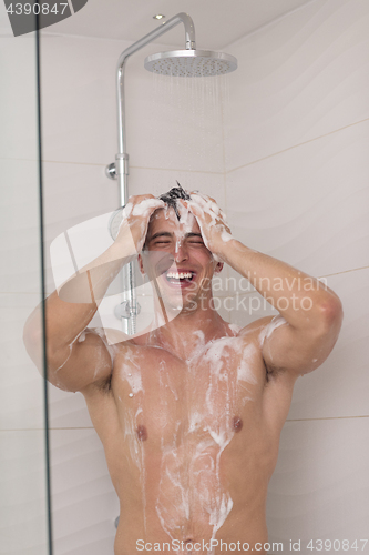 Image of man taking shower in bath