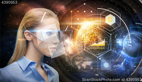 Image of woman in virtual reality glasses over space