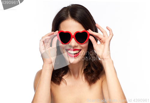 Image of woman with red lipstick and heart shaped shades