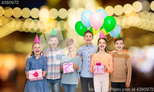 Image of happy children with gifts at birthday party