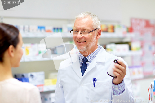 Image of apothecary and woman with drug at pharmacy