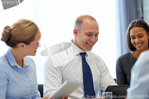 Image of business team with tablet pc computers at office