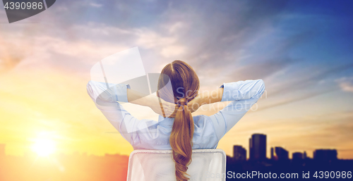 Image of businesswoman sitting on chair from back