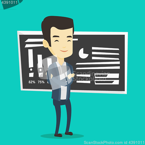 Image of Teacher or student standing in front of chalkboard