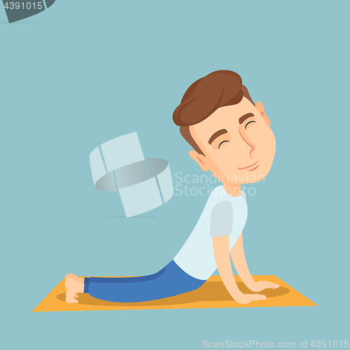 Image of Man practicing yoga upward dog pose.