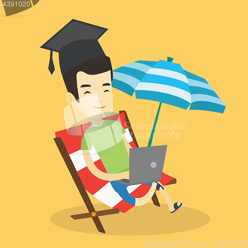 Image of Graduate lying in chaise lounge with laptop.