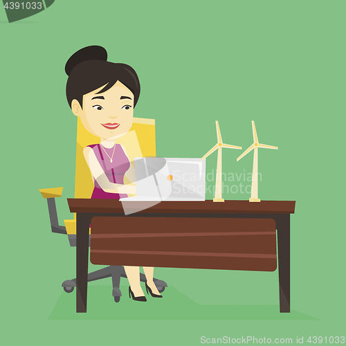 Image of Woman working with model of wind turbines.