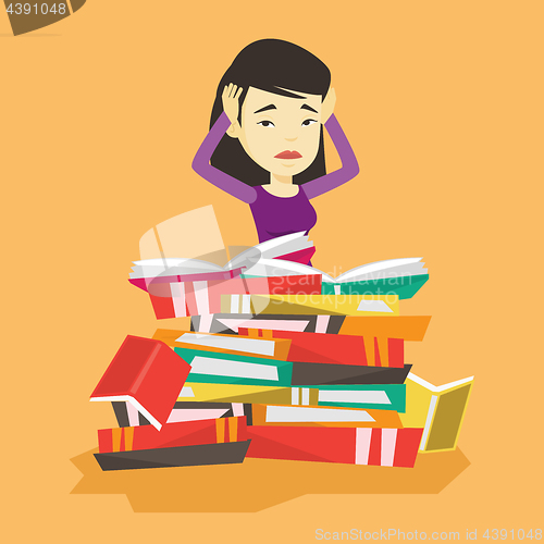 Image of Student sitting in huge pile of books.