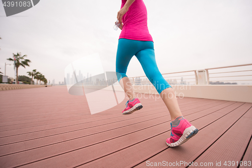 Image of woman running on the promenade