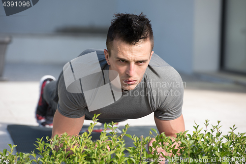 Image of man doing morning yoga exercises