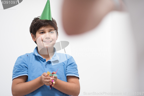 Image of kid blowing confetti