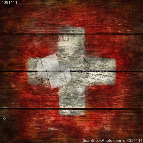 Image of swiss flag on wood