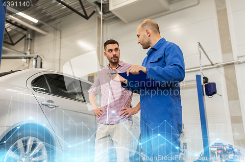 Image of auto mechanic with clipboard and man at car shop