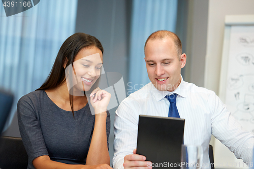 Image of business team with tablet pc at office