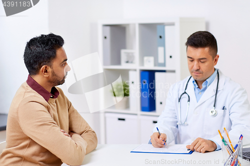 Image of doctor and male patient meeting at hospital