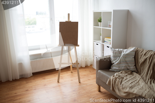 Image of wooden easel at home room or art studio