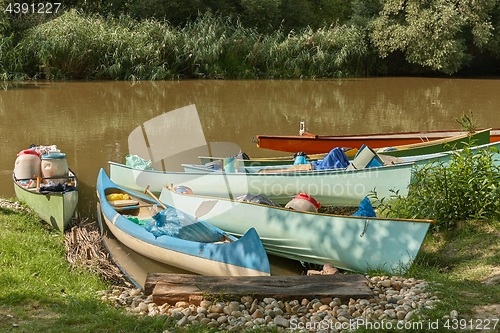 Image of Canoes on the Riverside