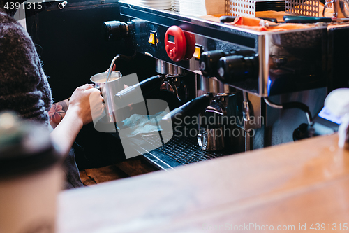 Image of Professional coffee maker in shop