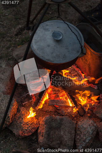 Image of Preparing food on campfire