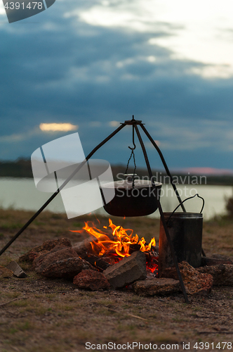 Image of Preparing food on campfire