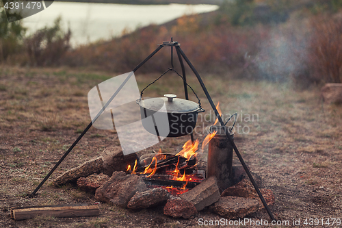 Image of Preparing food on campfire