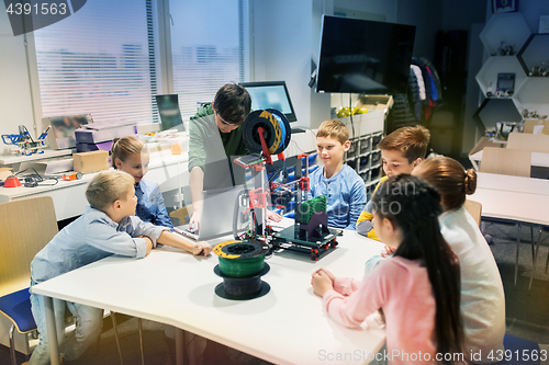 Image of happy children with 3d printer at robotics school