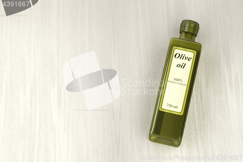 Image of Olive oil bottle on wood background