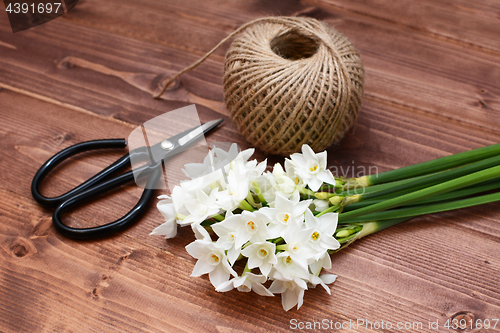 Image of Florist scissors with white narcissi and ball of twine