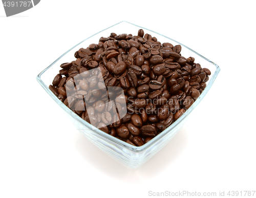 Image of Glass bowl filled to the brim with coffee beans