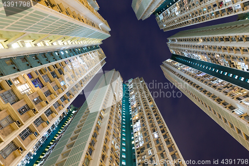 Image of Apartment building to the sky at night