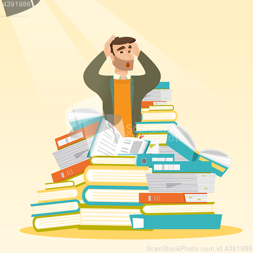 Image of Student sitting in huge pile of books.