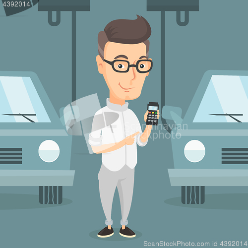 Image of Worker controlling automated assembly line for car