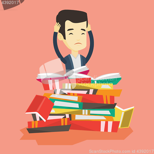 Image of Student sitting in huge pile of books.