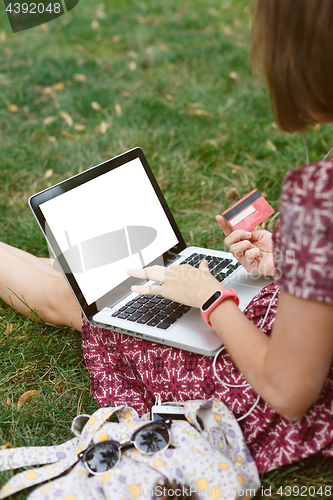 Image of Anonymous woman shopping in Internet