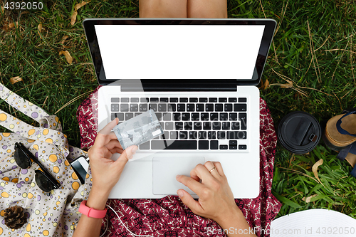 Image of Anonymous woman shopping in Internet