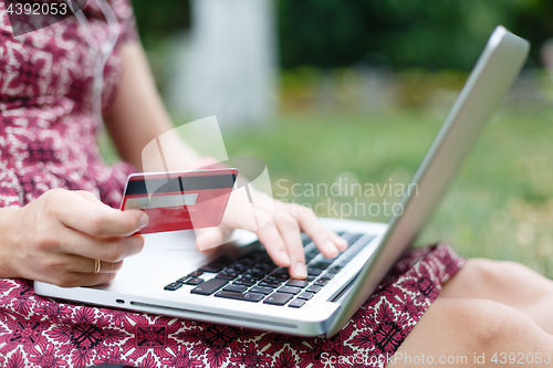 Image of Anonymous woman shopping in Internet